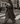 A member in a long wool coat crossing a London street with the Nouma paper