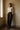 Wide-leg espresso trousers worn with a plain top, full length